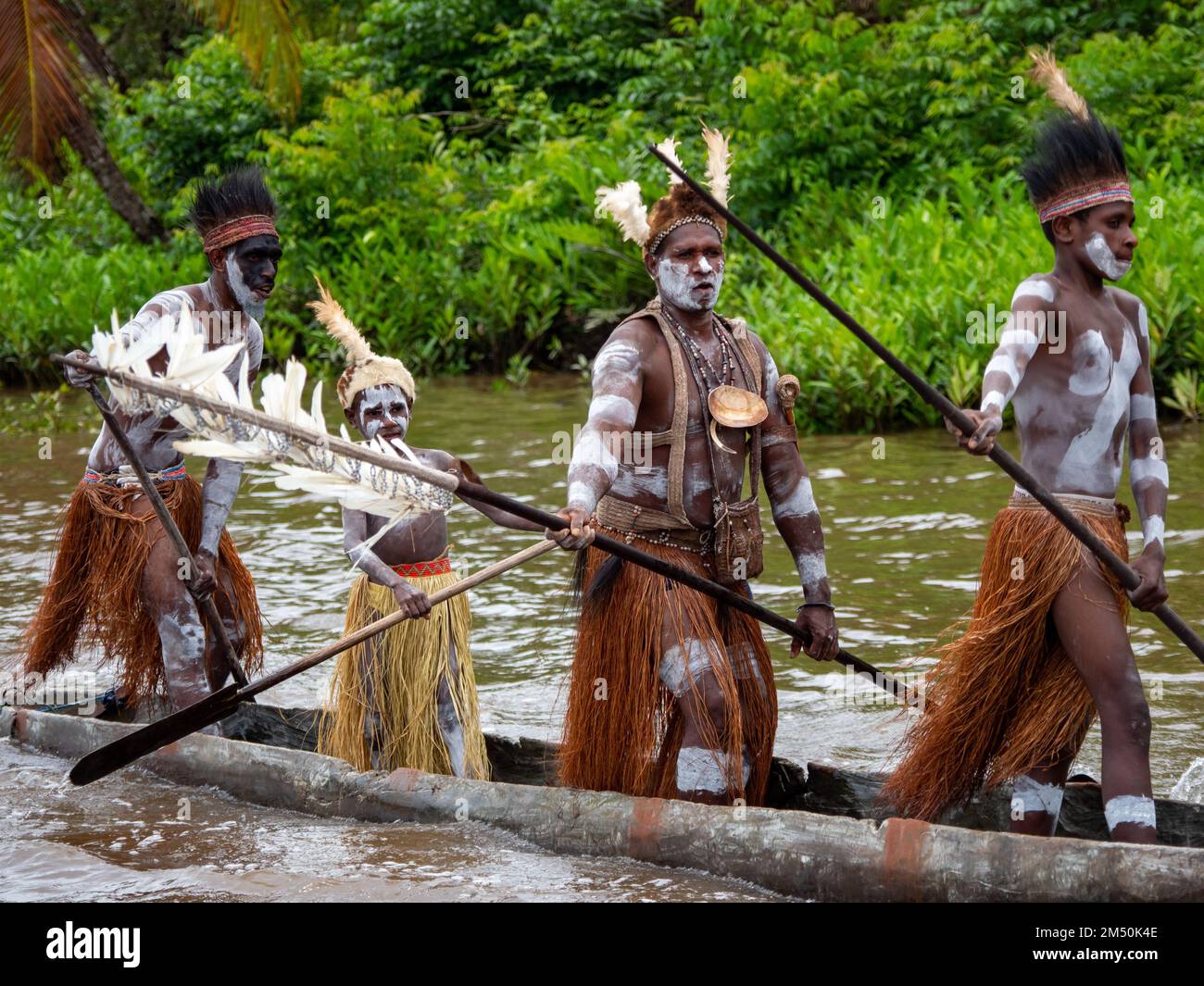 Canoe welcome to the Pem Village in the Asmat region of South Papua, Indonesia Stock Photo