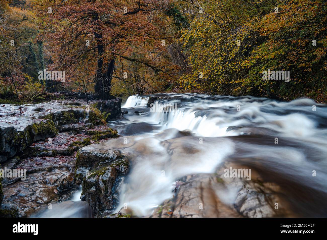 Sgwd y Pannwr waterfalls along the Four Waterfalls walk, Waterfall Country, Brecon Beacons national park, South Wales, the United Kingdom. Long exposure. Stock Photo