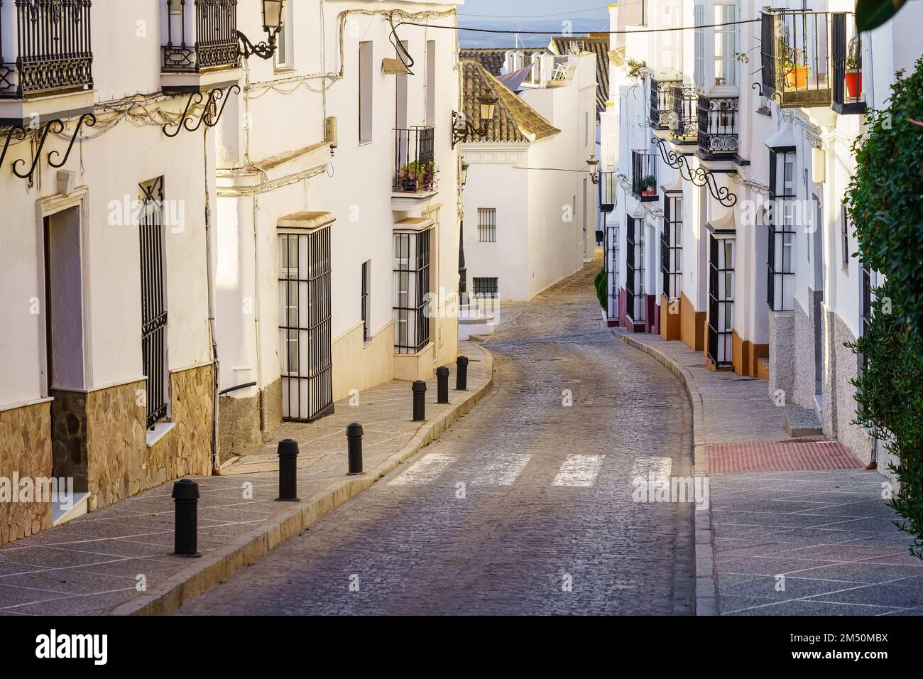Typical street of Andalusian village with its houses painted white and