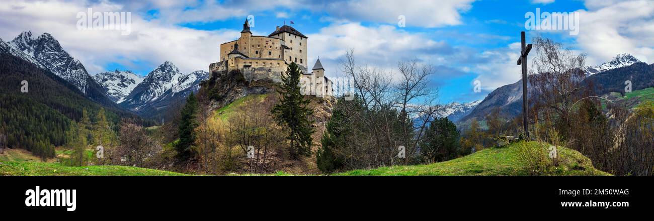 Switzerland travel and landmraks. Impressive  mountain scenery with amazing medieval castle Tarasp surrounded by  Swiss Alps, Canton Grisons or Graubu Stock Photo