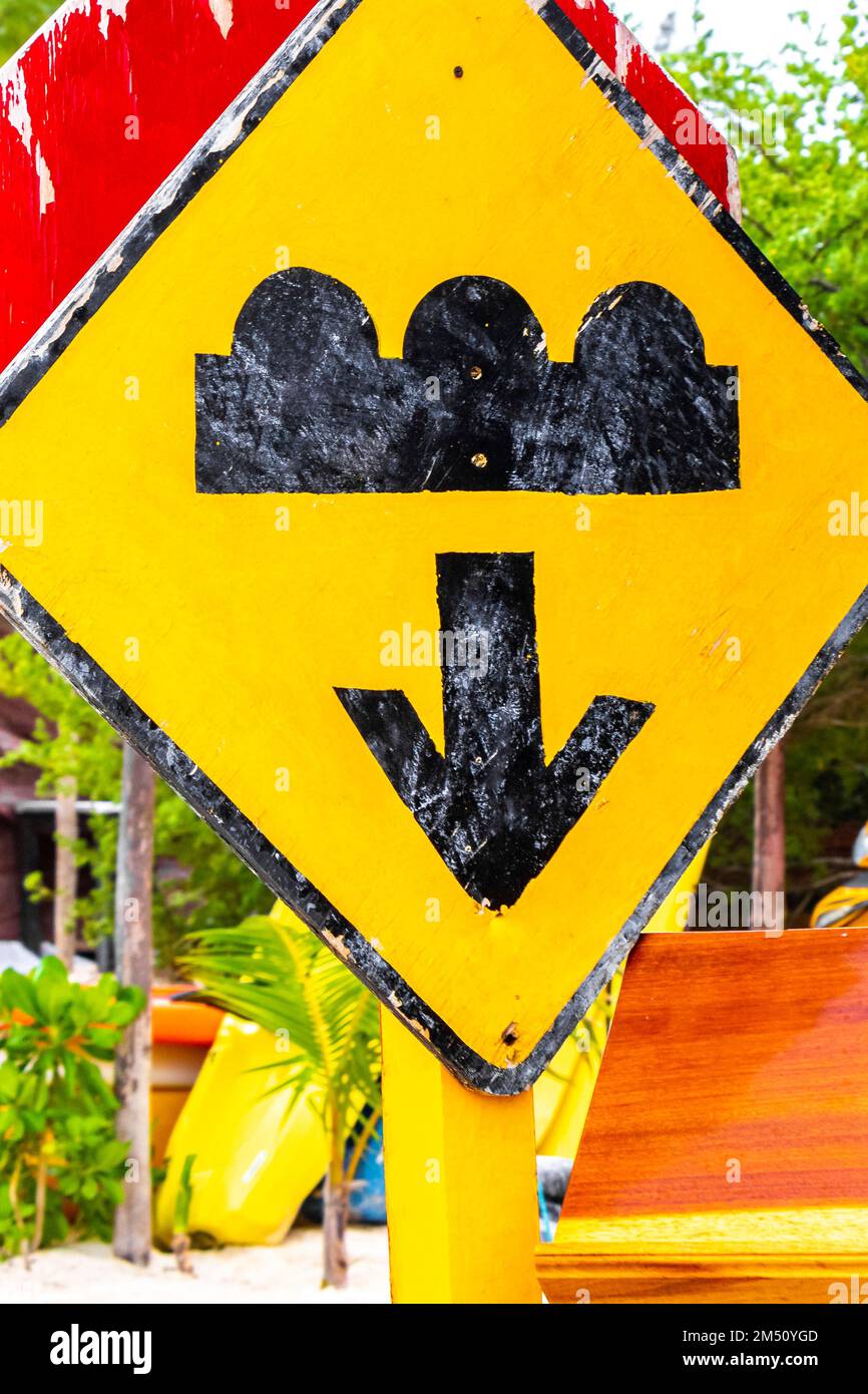 Traffic signs and road signs directional on Isla Holbox island in