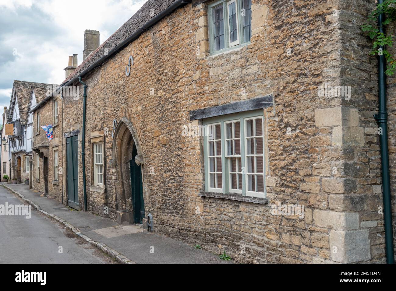 honey coloured Cotswold stone houses in Lacock The Cotswolds England