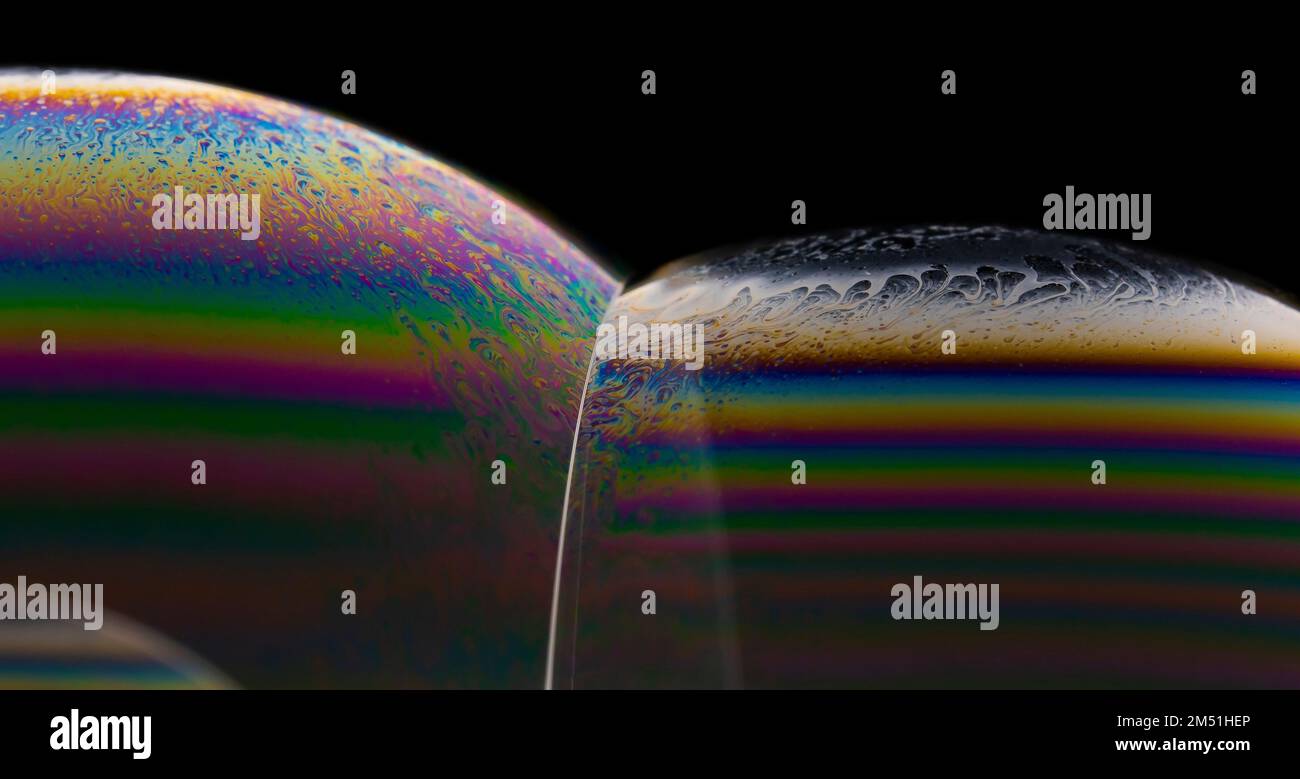 A macro shot of colorful soap bubbles on a black background Stock Photo ...