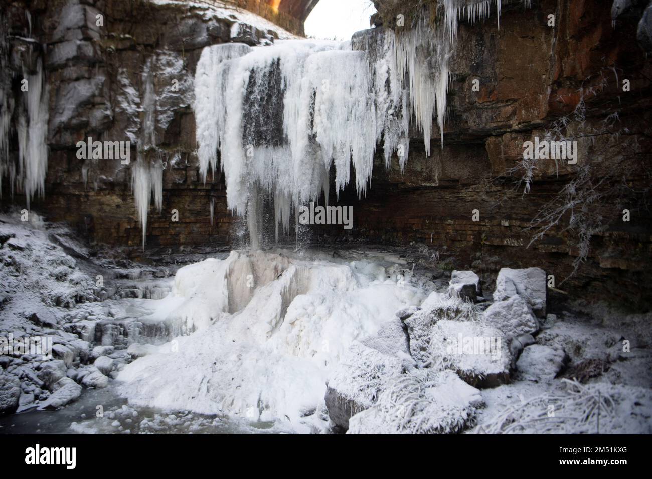 **NORMAL USAGE FEES APPLY**   Ashgill Force, Cumbria, UK - Saturday 17th December 2022;   People enjoying the icy conditions at Ashgill Force in Cumbr Stock Photo