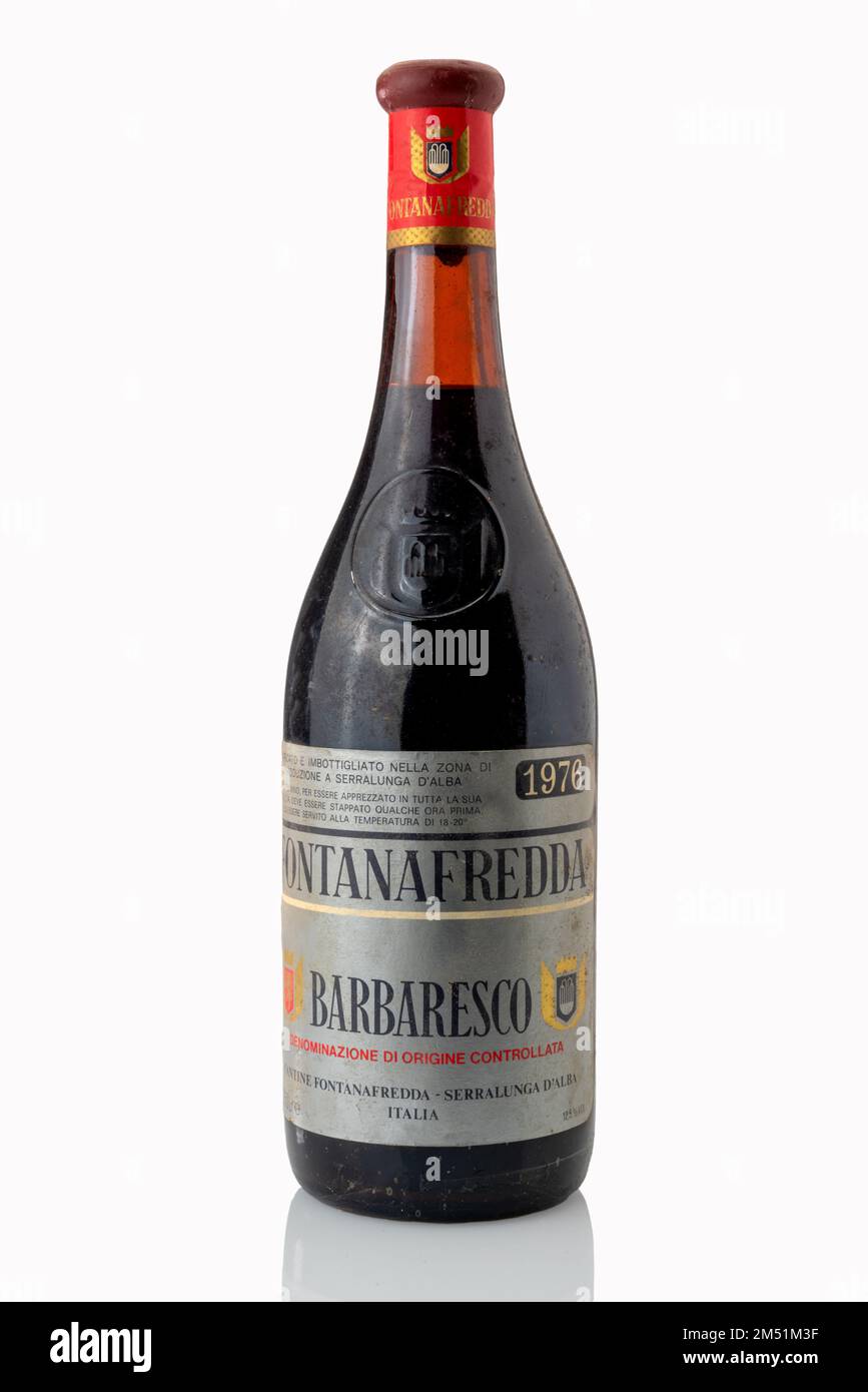 Alba, Italy - december 22, 2022: bottle of Barbaresco wine year 1976 from Fontafredda cellars of Serralunga di Alba, Old bottle covered with powder to Stock Photo