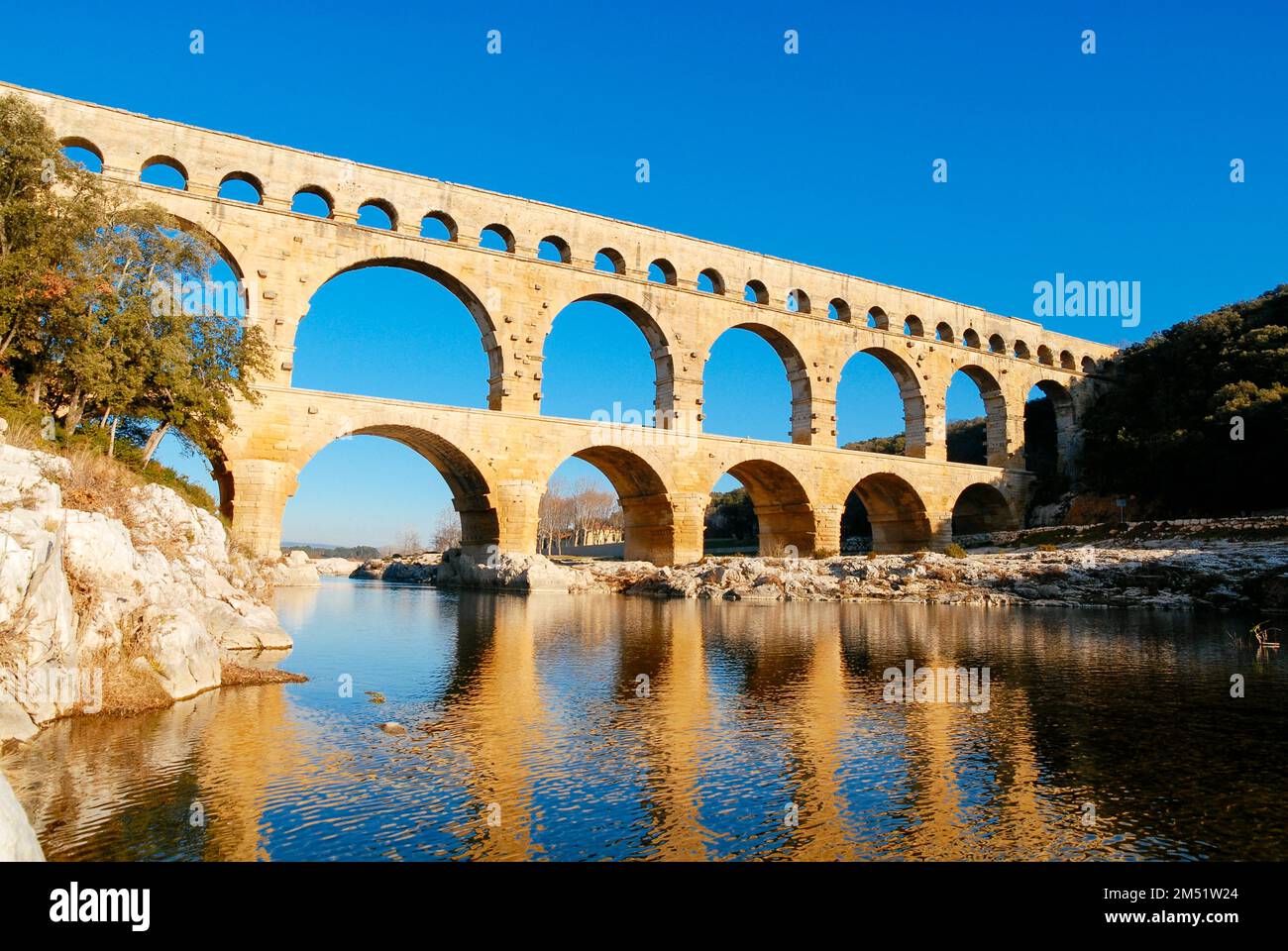 The arches of the Pont Du Gard in the low winter sun. Stock Photo