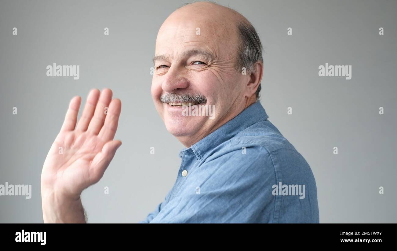 Portrait welcoming old man waving hi-res stock photography and images ...