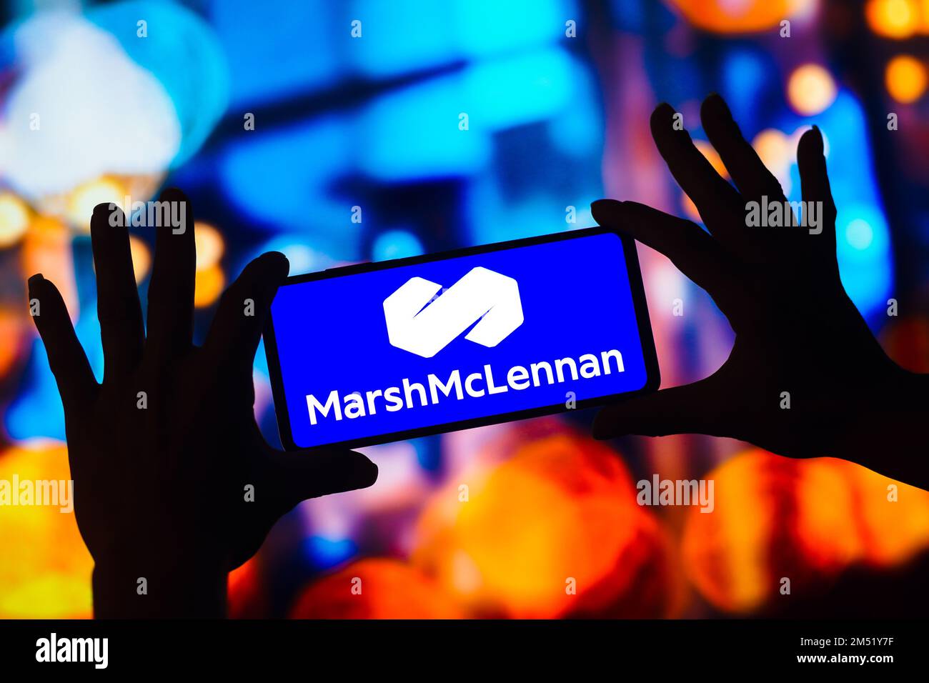 In this photo illustration, the Marsh and McLennan Companies, Inc. logo ...