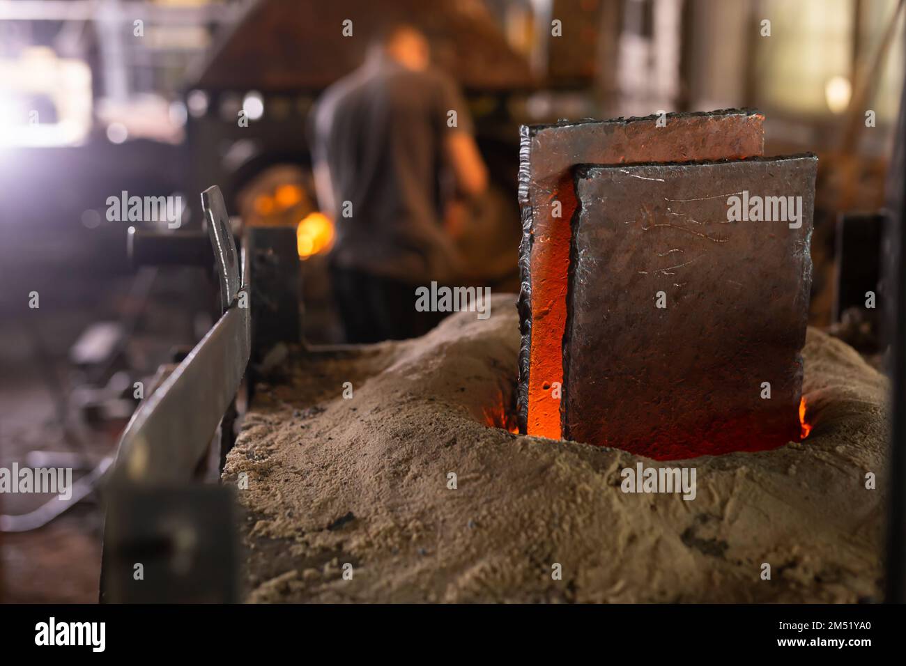 Metal melting in an induction furnace Stock Photo