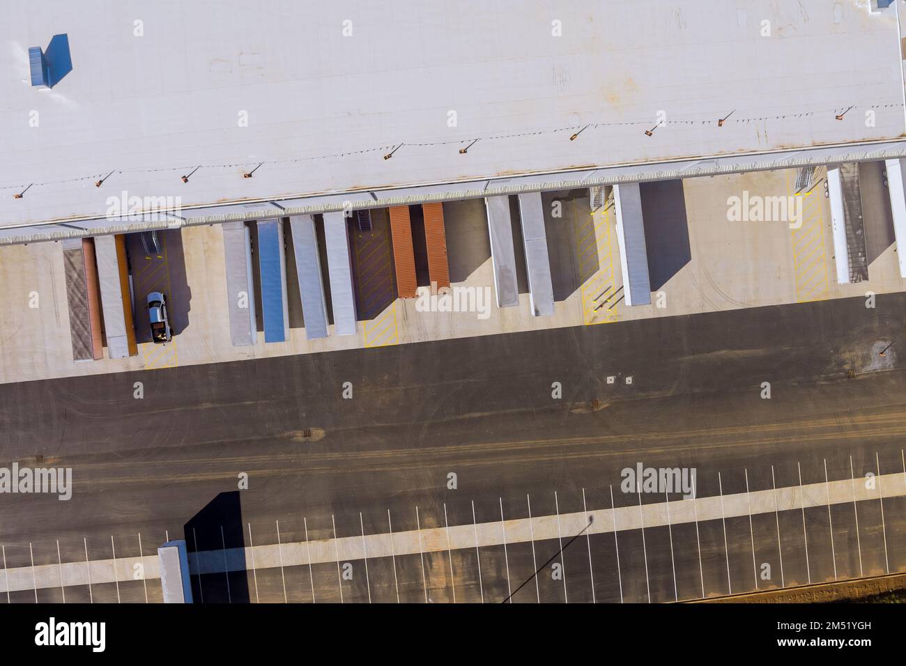 Aerial top view of industrial zone with buildings and cargo trailer