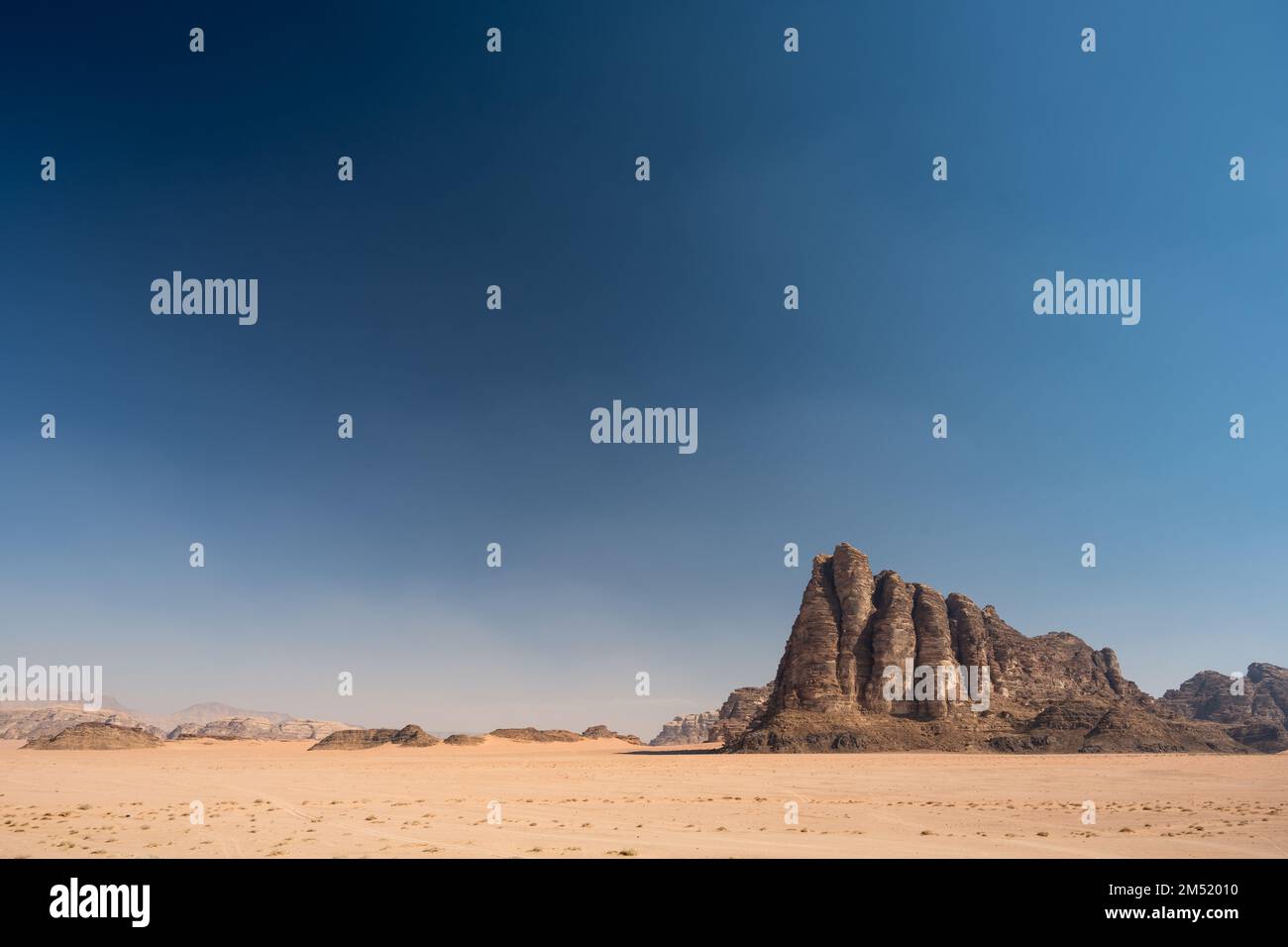 Seven Pillars of Wisdom or Jabal al-Mazmar Mountain in the Desert of Wadi Rum, Jordan Stock Photo