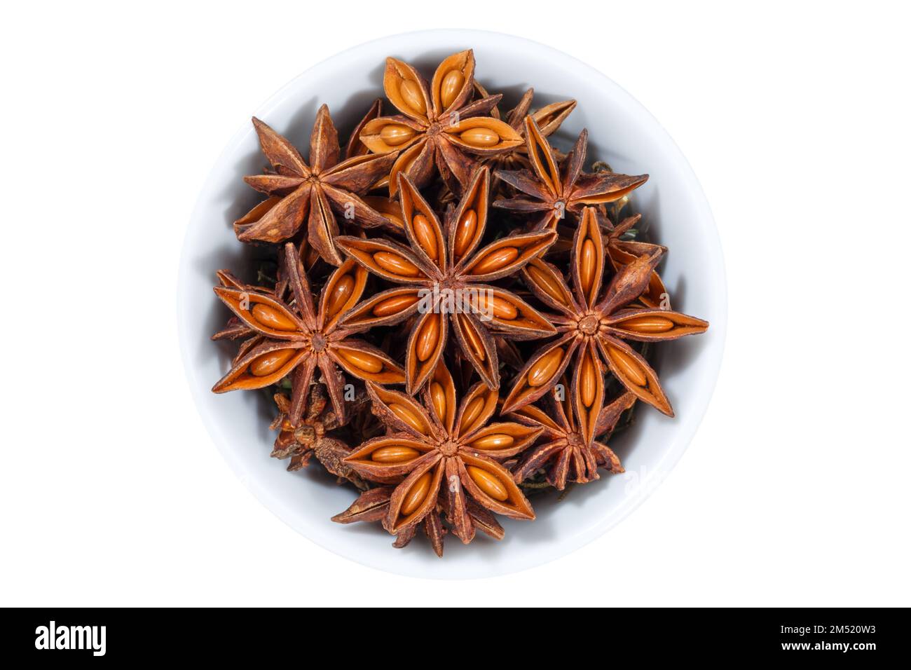 Star anise star-anise Christmas spice herb from above bowl isolated on a white background Stock Photo