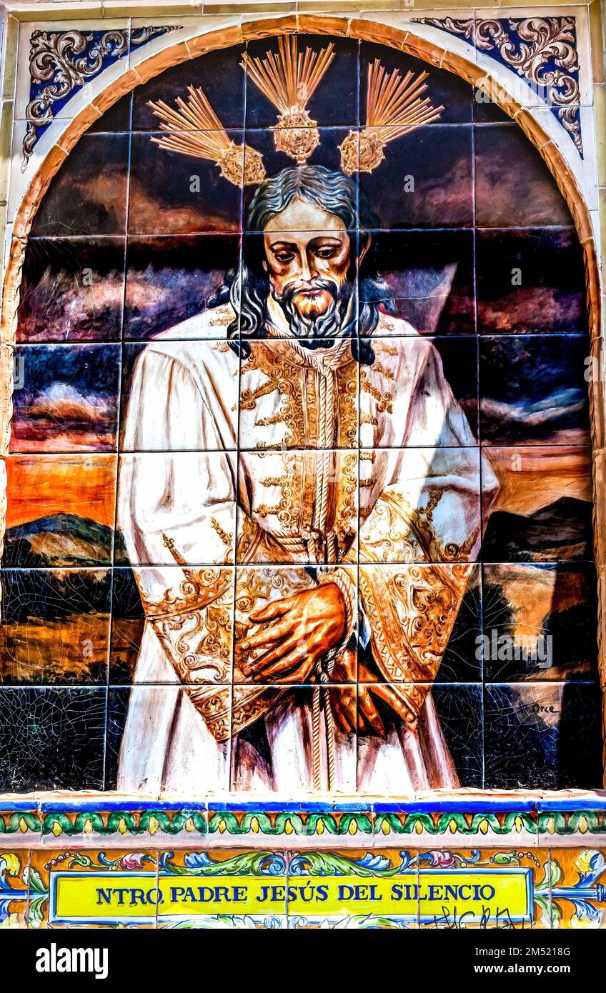 Silent Jesus Street Ceramic Tile Mosaic Seville Andalusia Spain Spanish words say in English Our Father Jesus of Silence One of symbols floats for hol Stock Photo