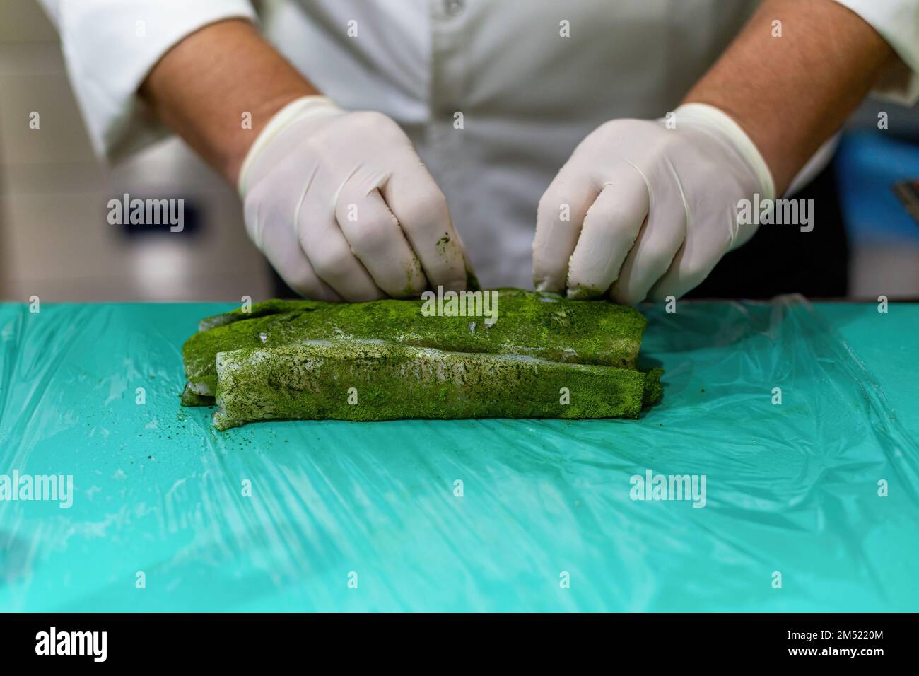 The chef cooking sole. Marinating fish with a mixture of 5 spices