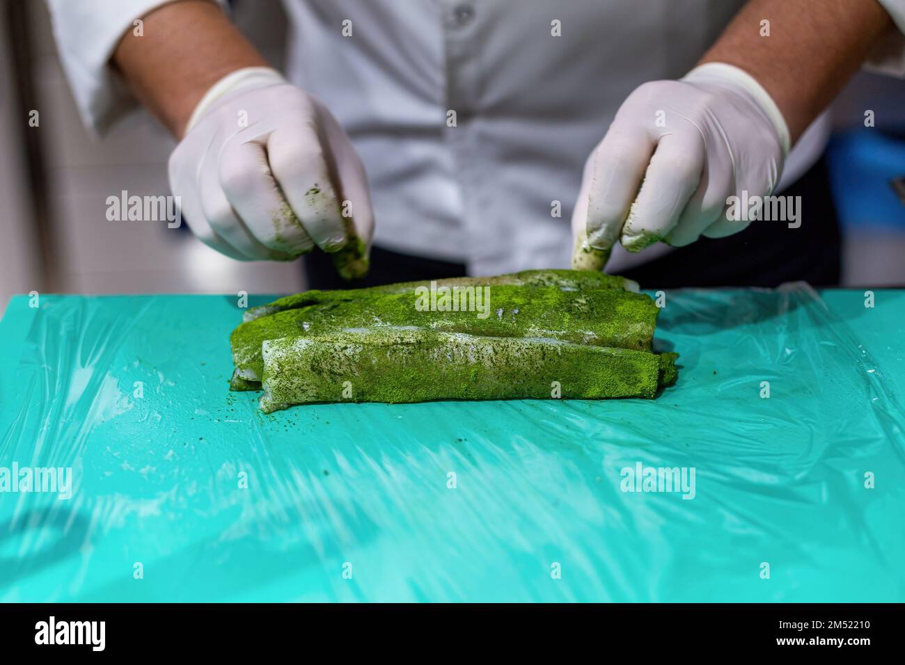The chef cooking sole. Marinating fish with a mixture of 5 spices