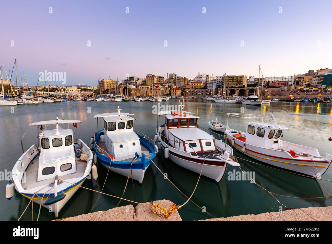 Crete Heraklion Greece port harbor boats twilight blue hour travelling Stock Photo