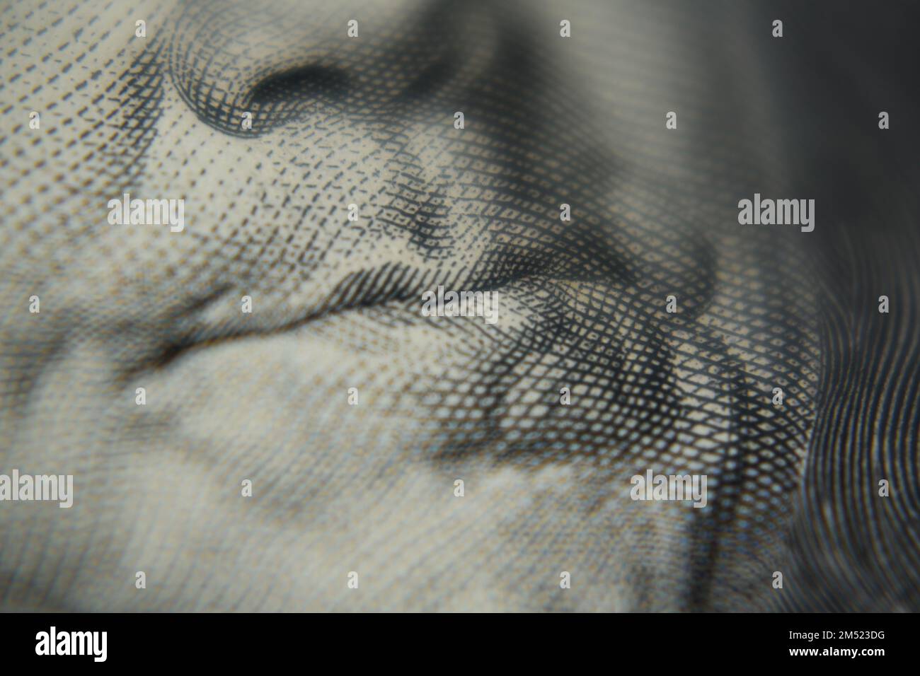 Close up shot of Benjamin Franklin's mouth on a hundred dollar banknote. Stock Photo