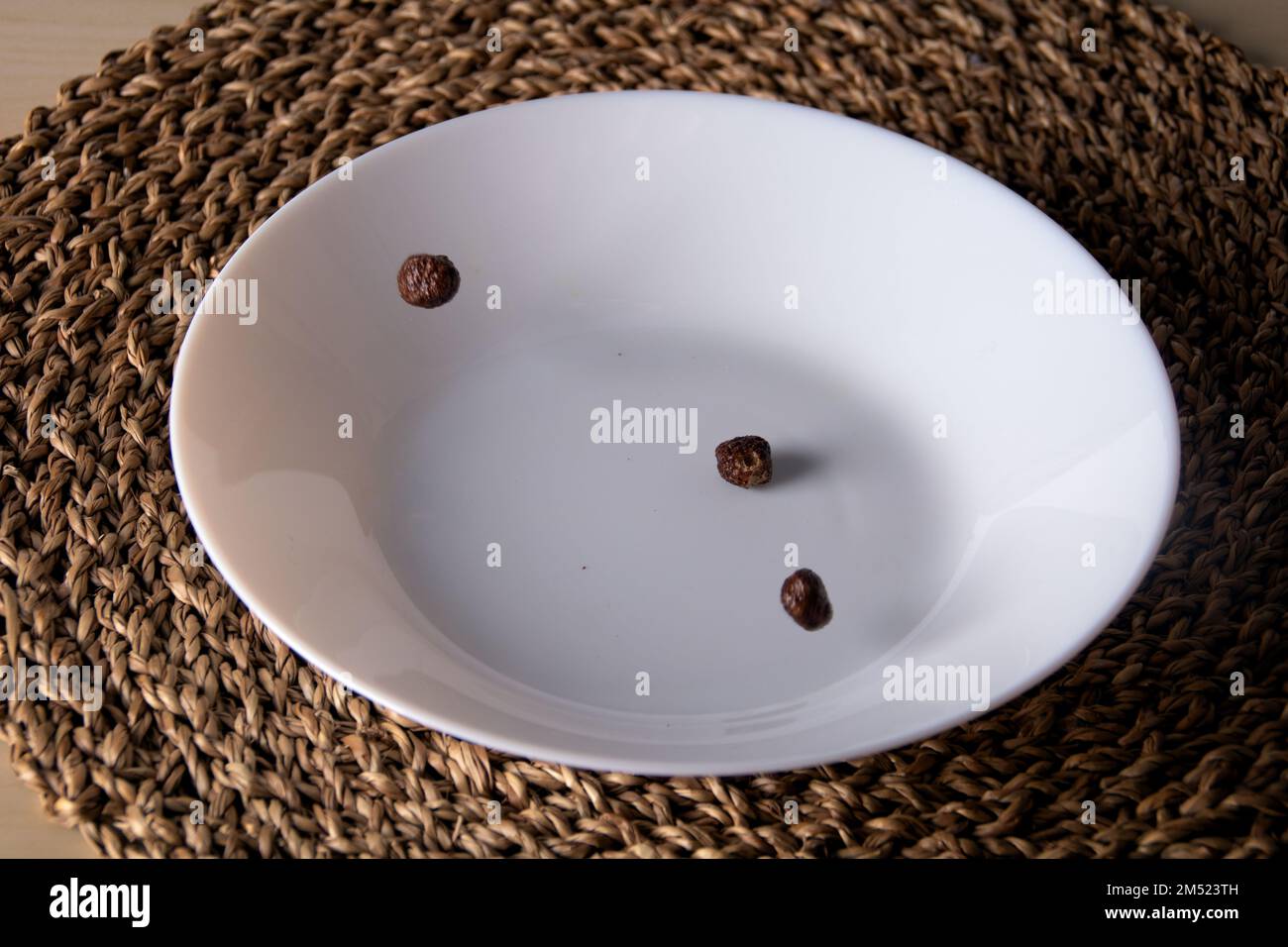 photo several cereal balls lies in a deep white plate Stock Photo