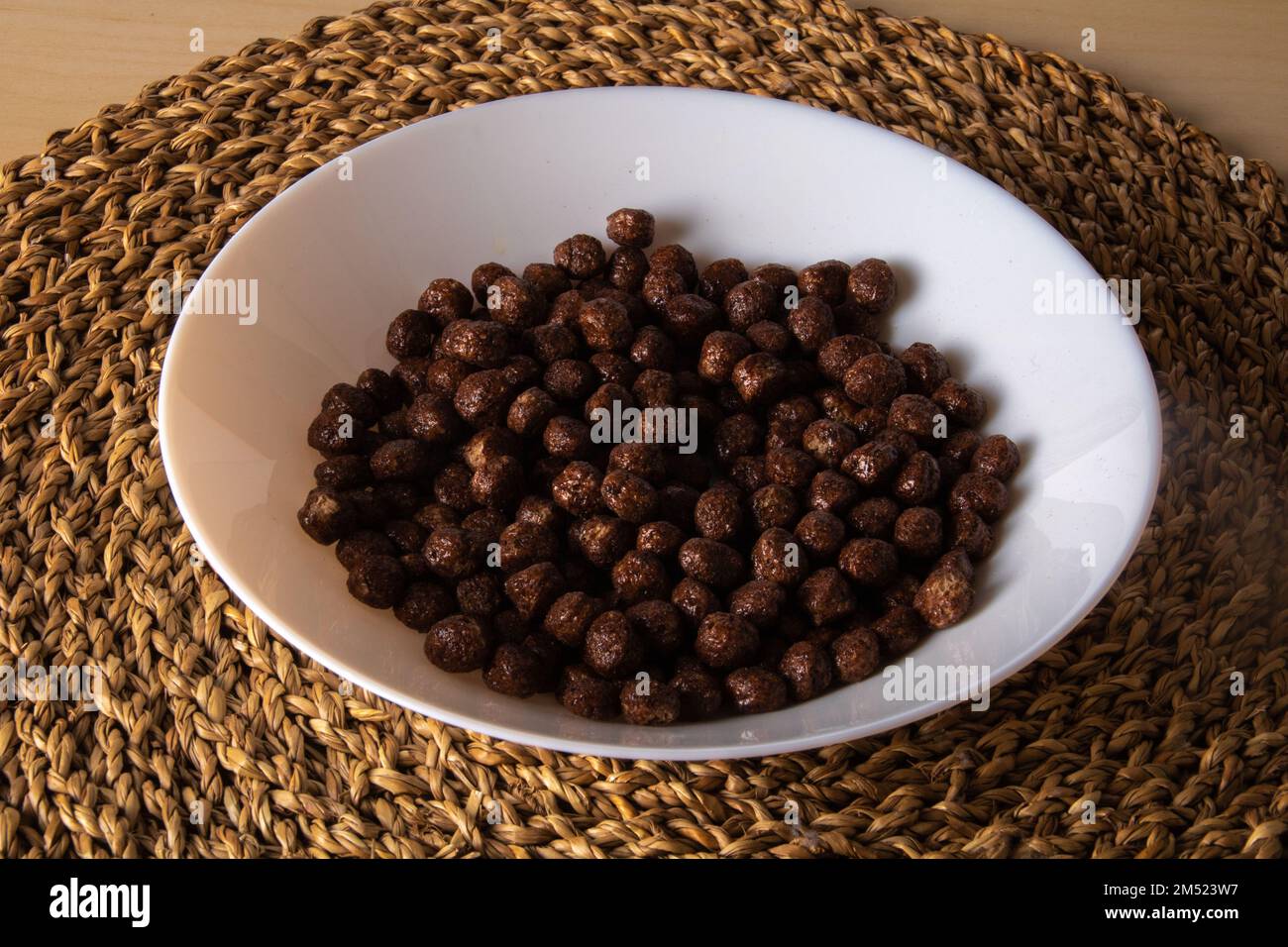 photo of dried chocolate cereal balls lying in a plate Stock Photo