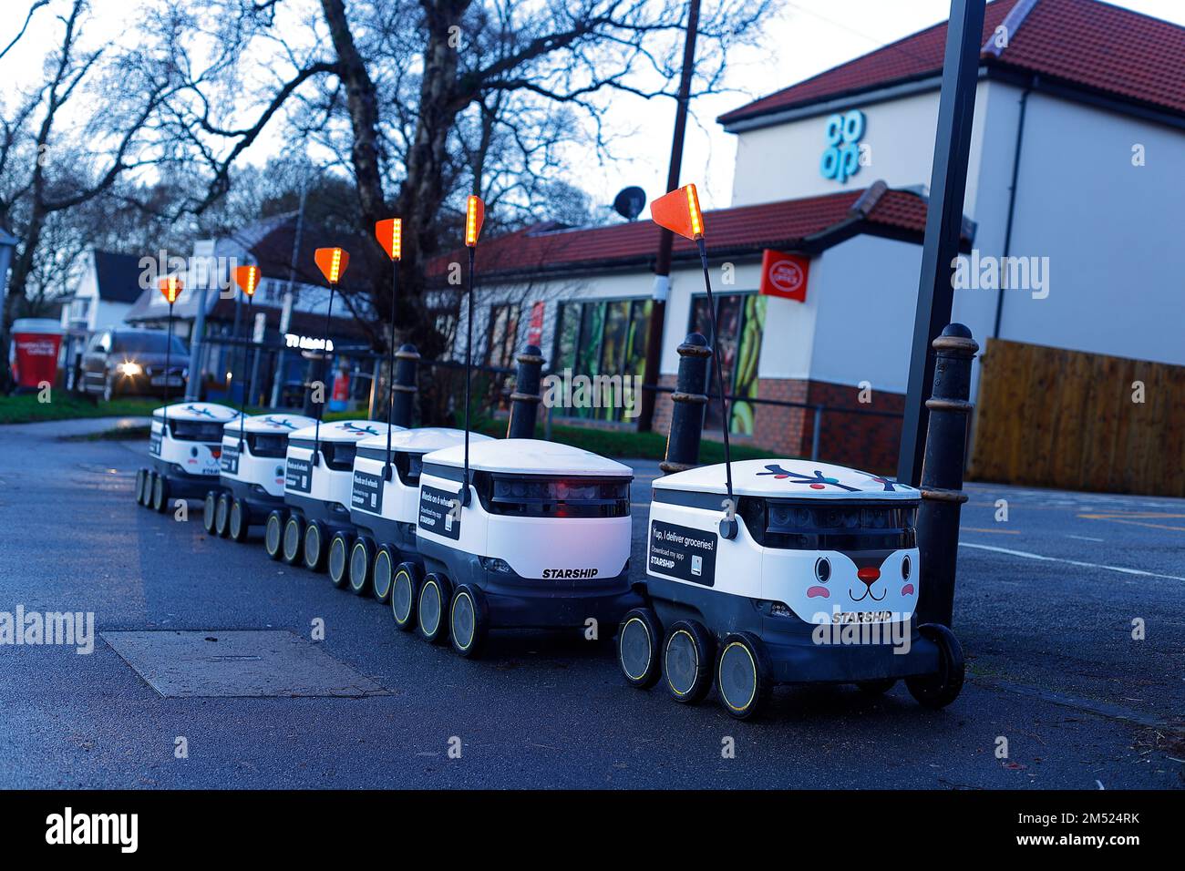 A line of autonomous robots await instructions before carrying out
