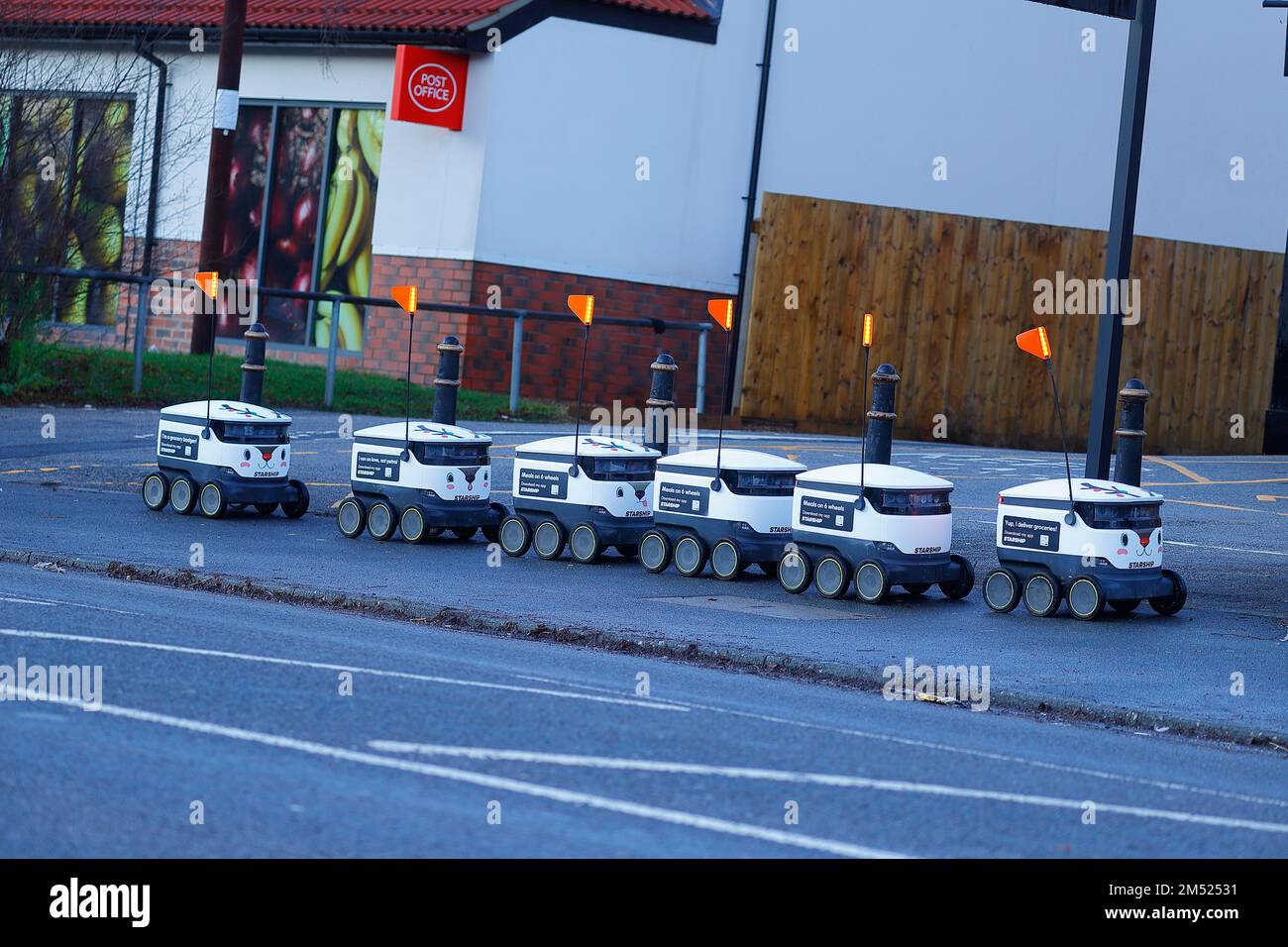 A line of autonomous robots await instructions before carrying out