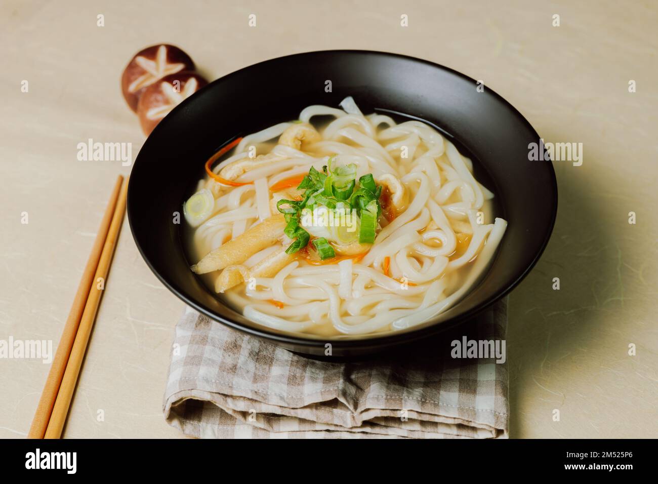 Kalguksu, Korean style noodle soup :Fresh knife-cut noodles, made by rolling flour dough and slicing into thin noodles, cooked in anchovy sauce. Zucch Stock Photo