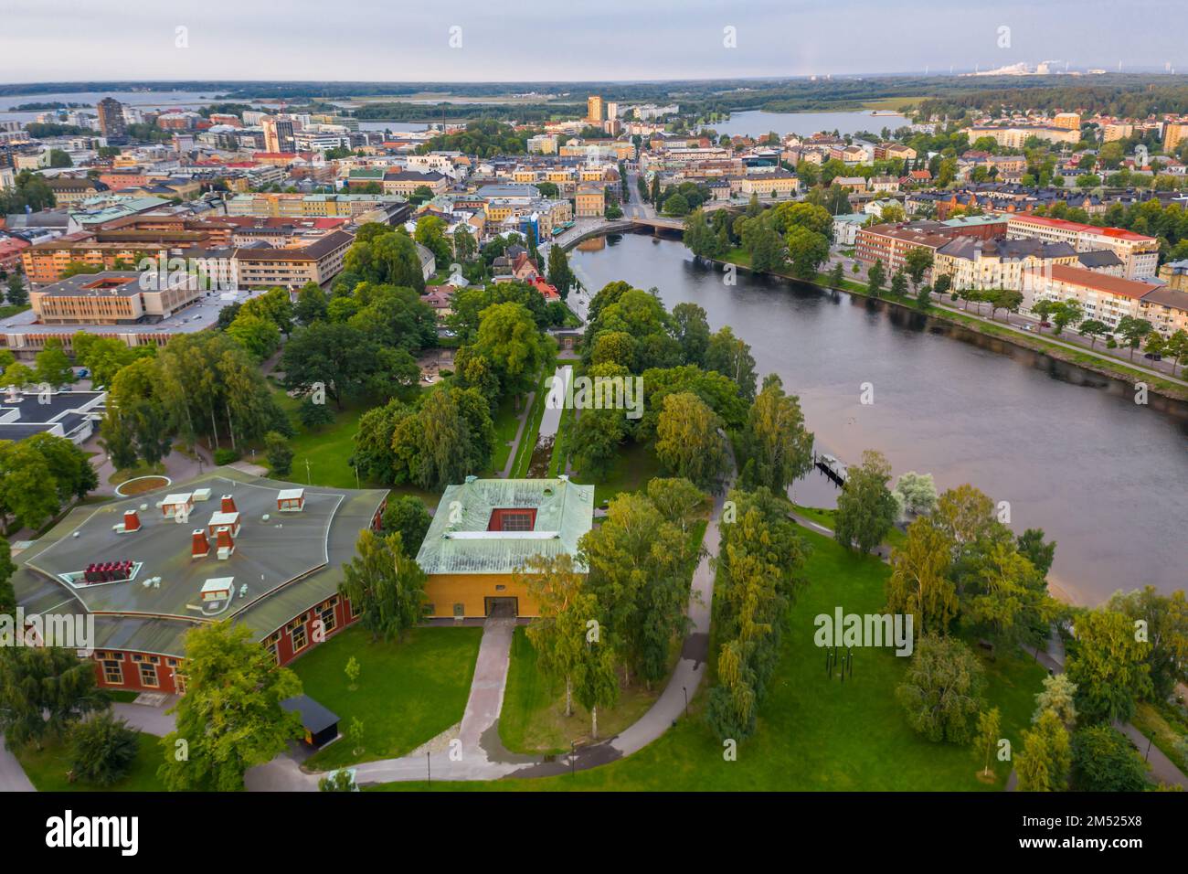 An aerial view of a town with a river and old buildings in cloudy sky ...
