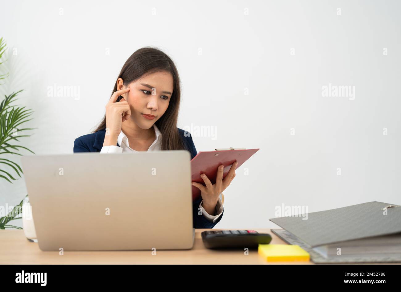 Happy young Asian women startup entrepreneur happy conference with partner for check paperwork before sign business contact, happy girl on the workpla Stock Photo