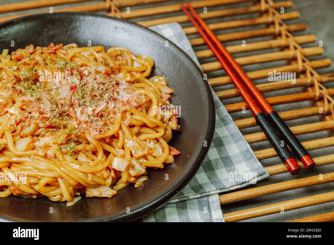 Delicious yakisoba dish on a black plate Stock Photo