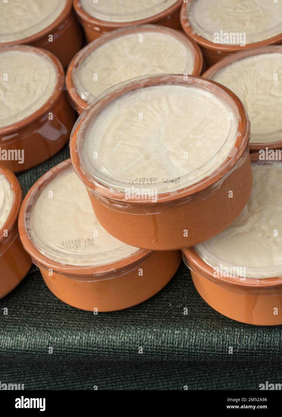 Kaymak, a creamy dairy product similar to cream, made from milk, in clay pots Stock Photo