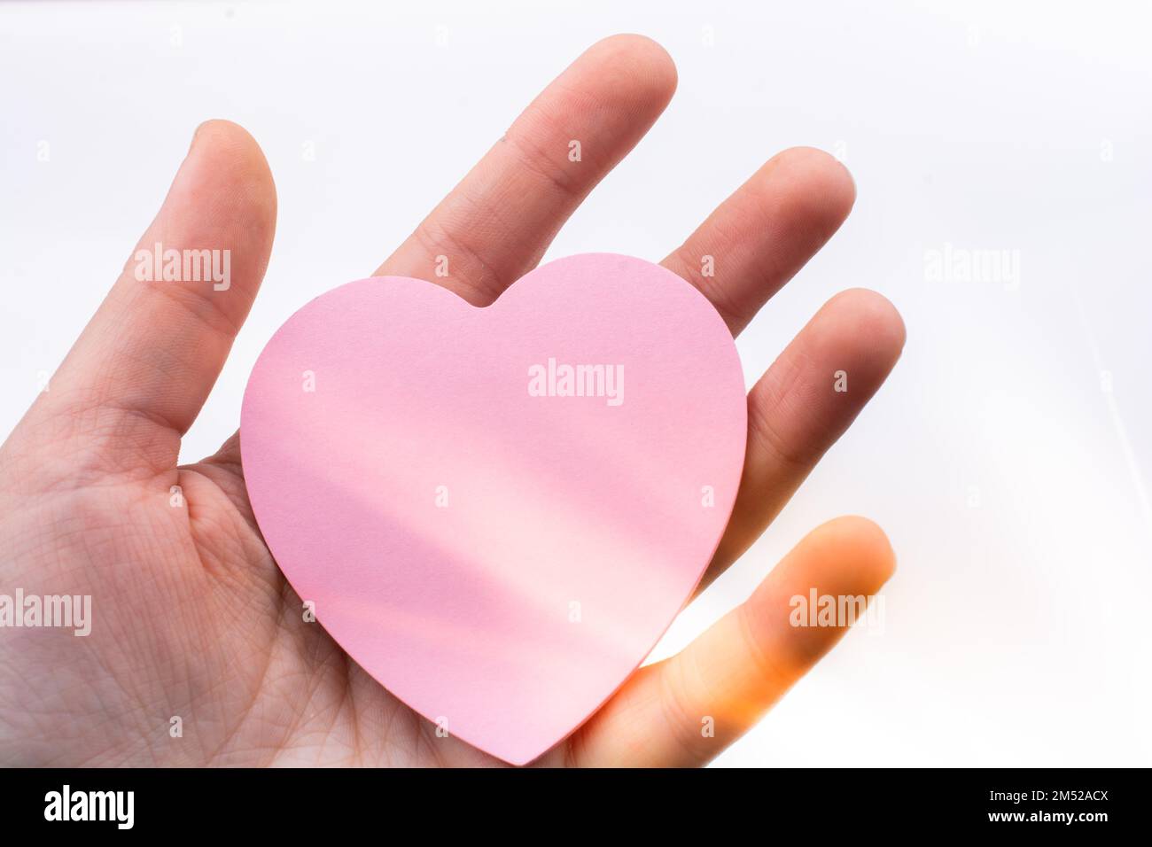 Pink color in hand hi-res stock photography and images - Alamy
