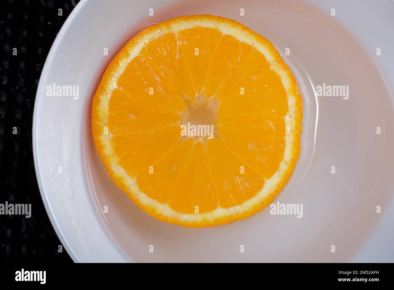 A view of a juicy, sweet and ripe cut orange fruit Stock Photo