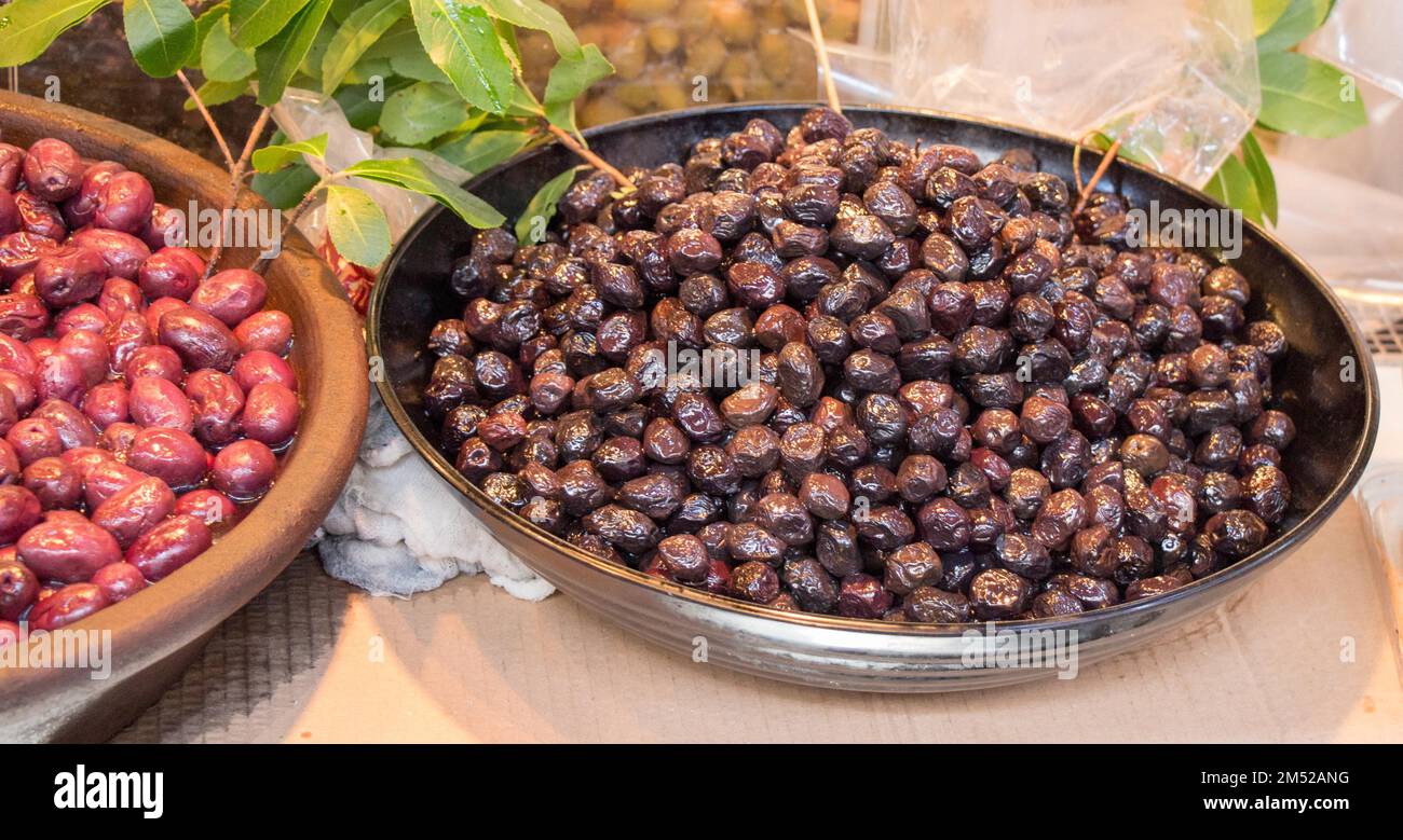 Turkish style prepared olives in the market stands Stock Photo