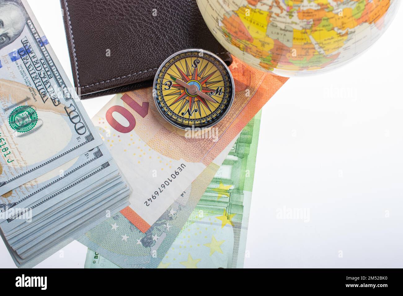 Compass, wallet, Euro banknotes with Euro currency finance direction Stock Photo