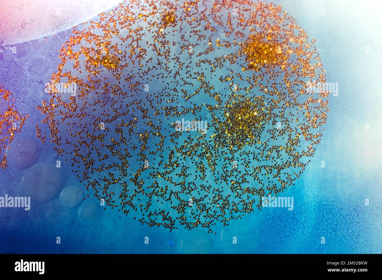 Oil bubbles inside water base form patterns Stock Photo