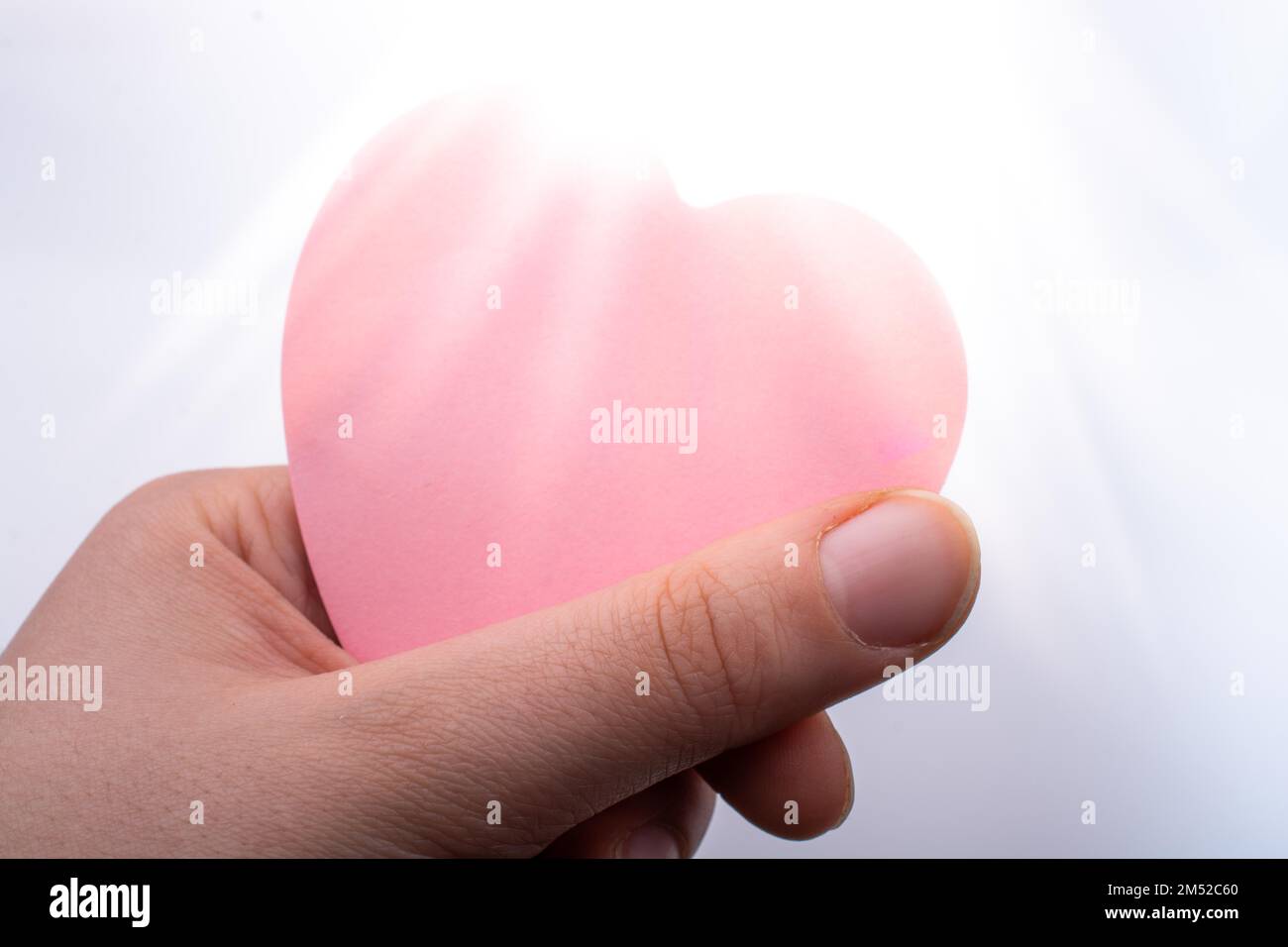 Pink color in hand hi-res stock photography and images - Alamy