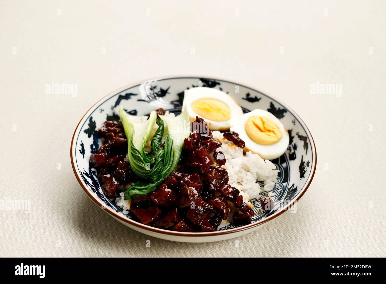Taiwanese Food, Lu Rou Fan,  Braised Pork Meat on Steamed Rice with Boiled Egg and Pak Choy. Copy Space for Text Stock Photo