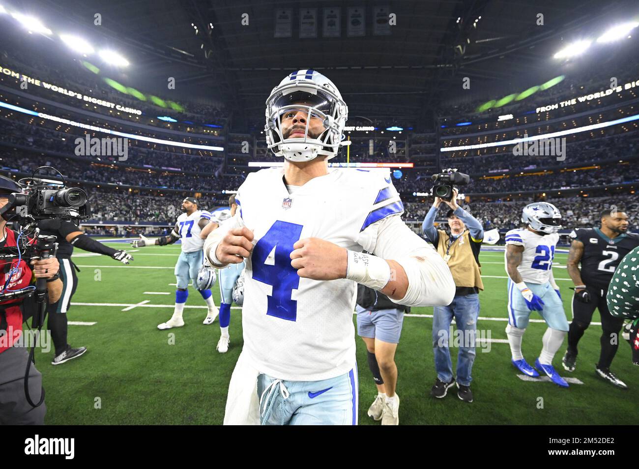 Arlington, United States. 24th Dec, 2022. Dallas Cowboys Dak Prescott gets  stopped by and Philadelphia Eagles T.J. Edwards during their NFL game at  AT&T Stadium in Arlington, Texas on Saturday, December 24