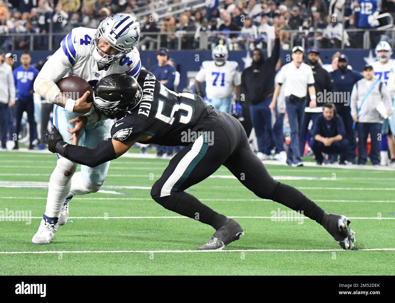 Arlington, United States. 24th Dec, 2022. Dallas Cowboys Dak Prescott gets  stopped by and Philadelphia Eagles T.J. Edwards during their NFL game at  AT&T Stadium in Arlington, Texas on Saturday, December 24,
