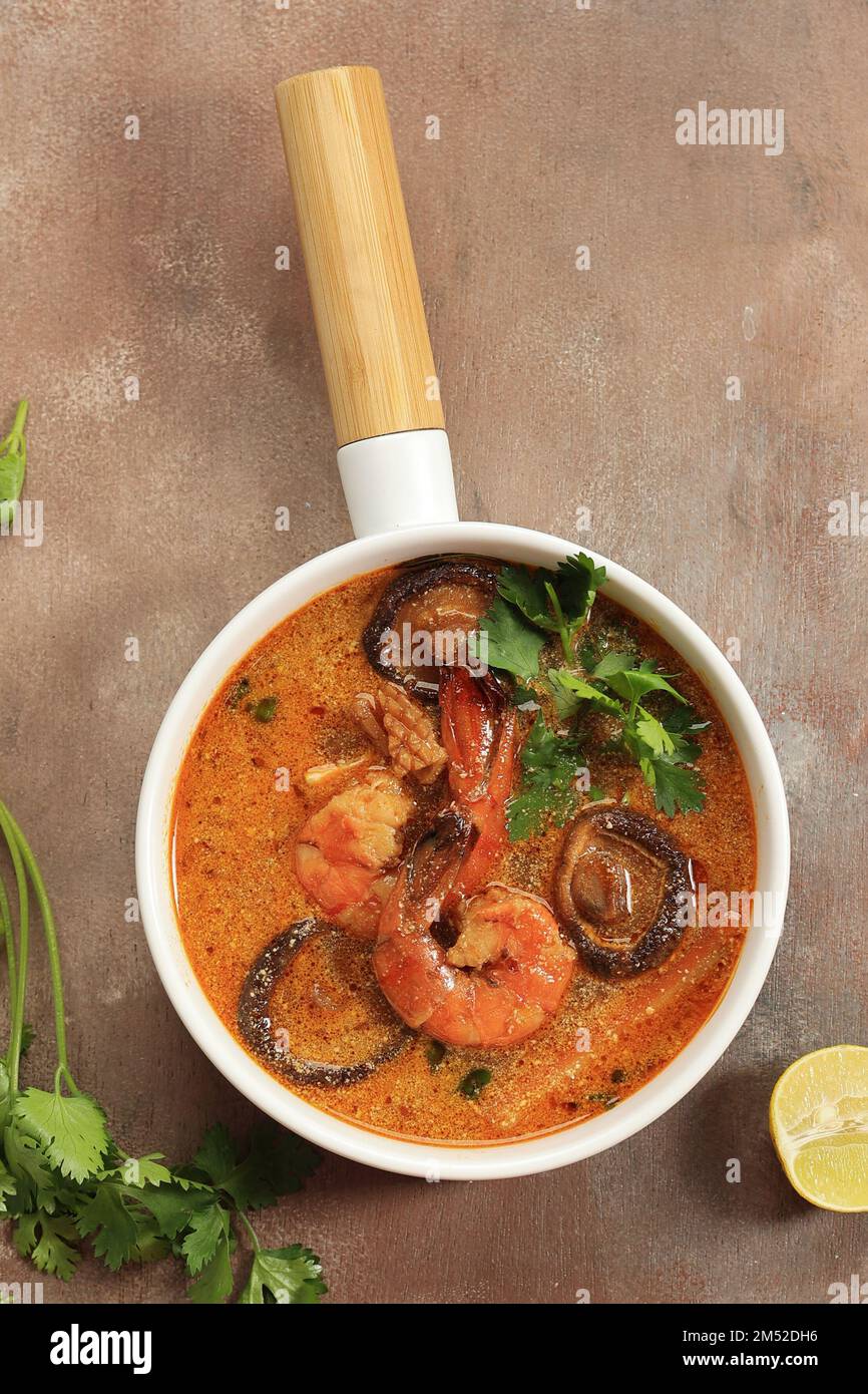 Top View Thai Curry Seafood  Prawn with Mushroom on White Ceramic Bowl Stock Photo