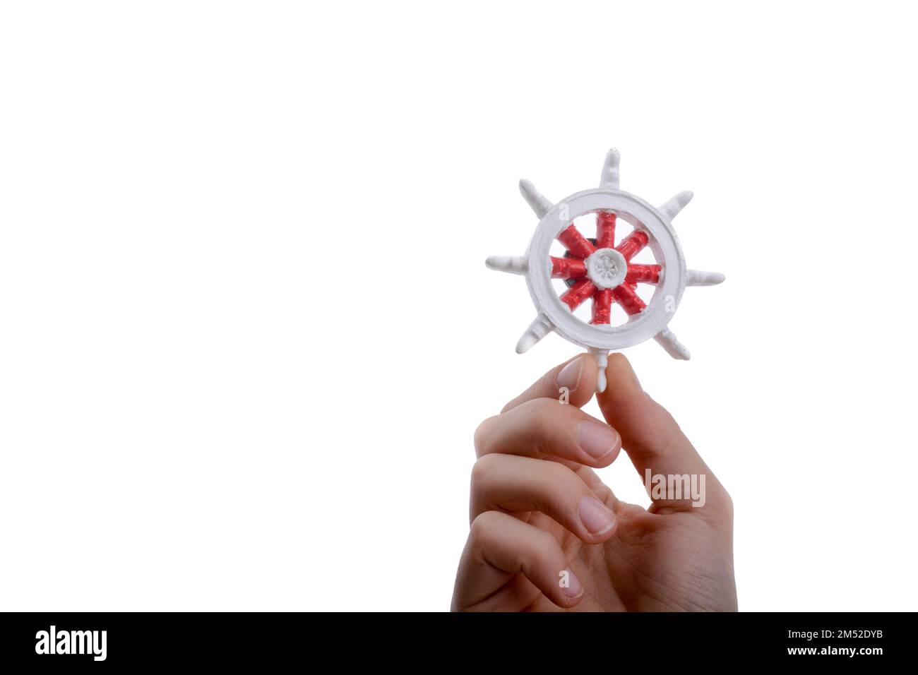 Isolated Ship steering wheel onhand Stock Photo - Alamy