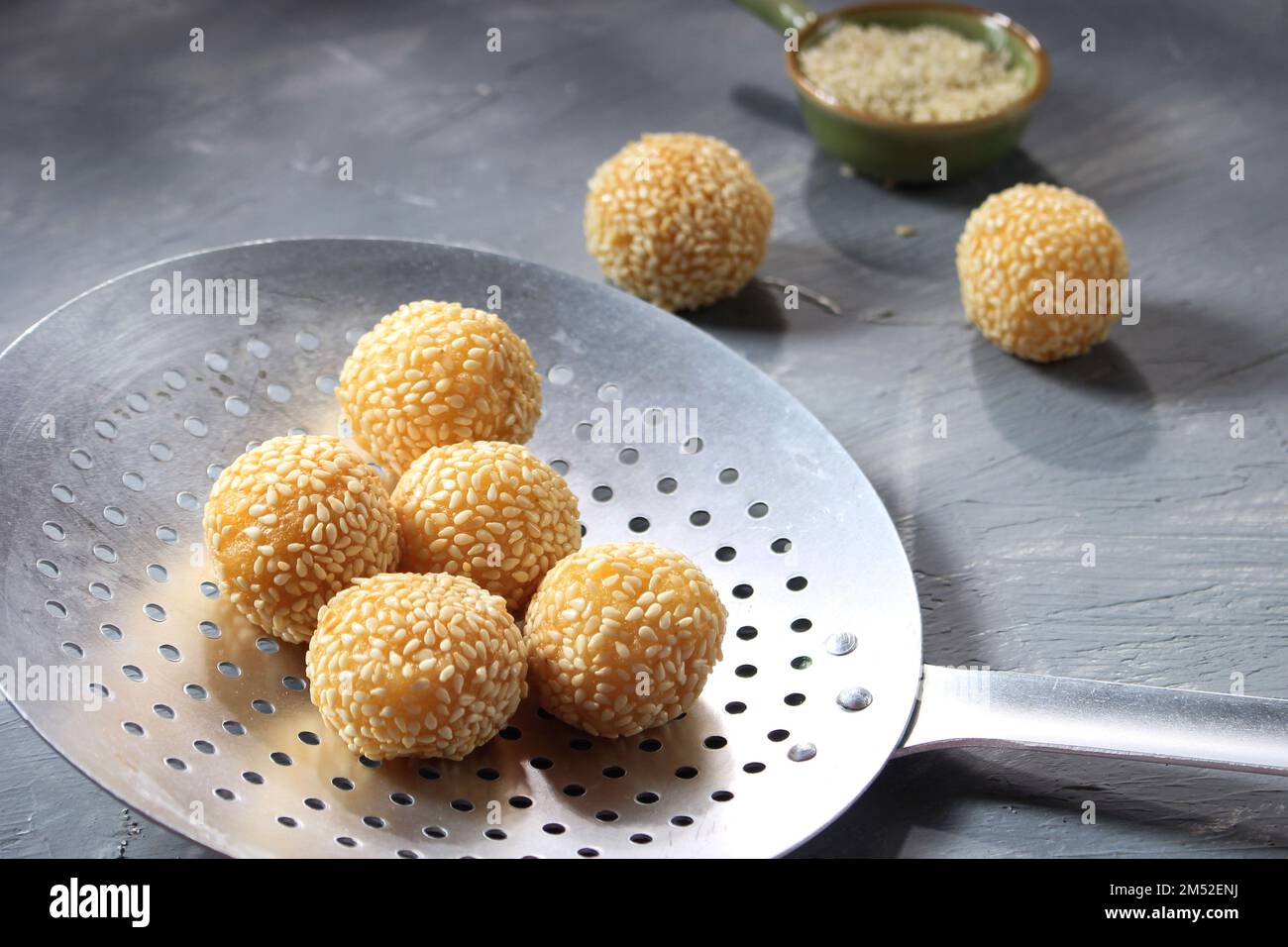 Chinese Sesame Ball or Kuih Bom or Onde-onde. Selective Focus Stock Photo