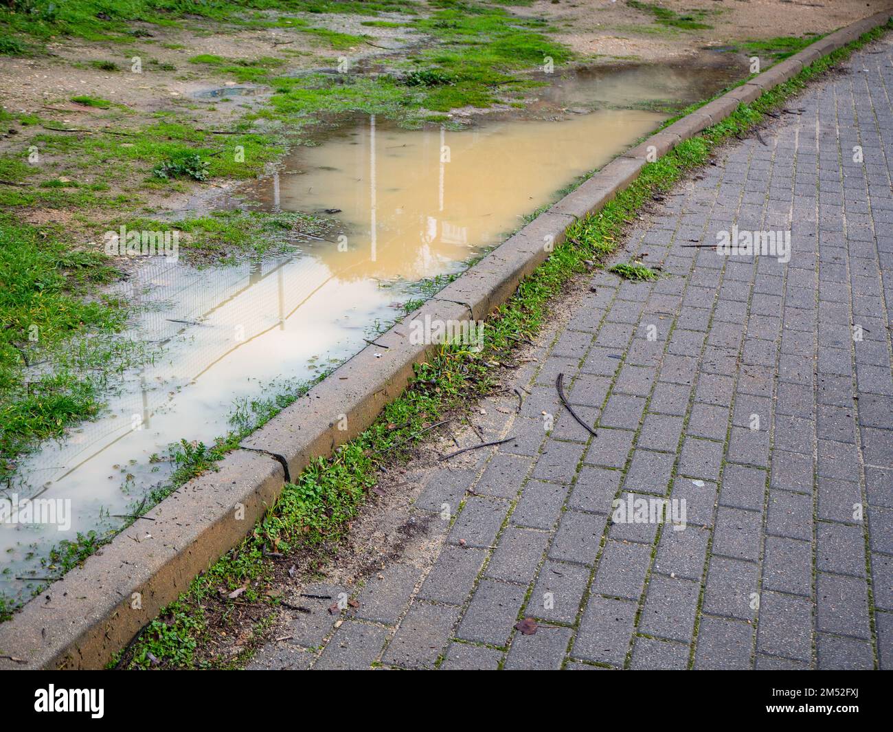 asphalt road flooded during the rainy season. Concept of risk and rainfall Stock Photo