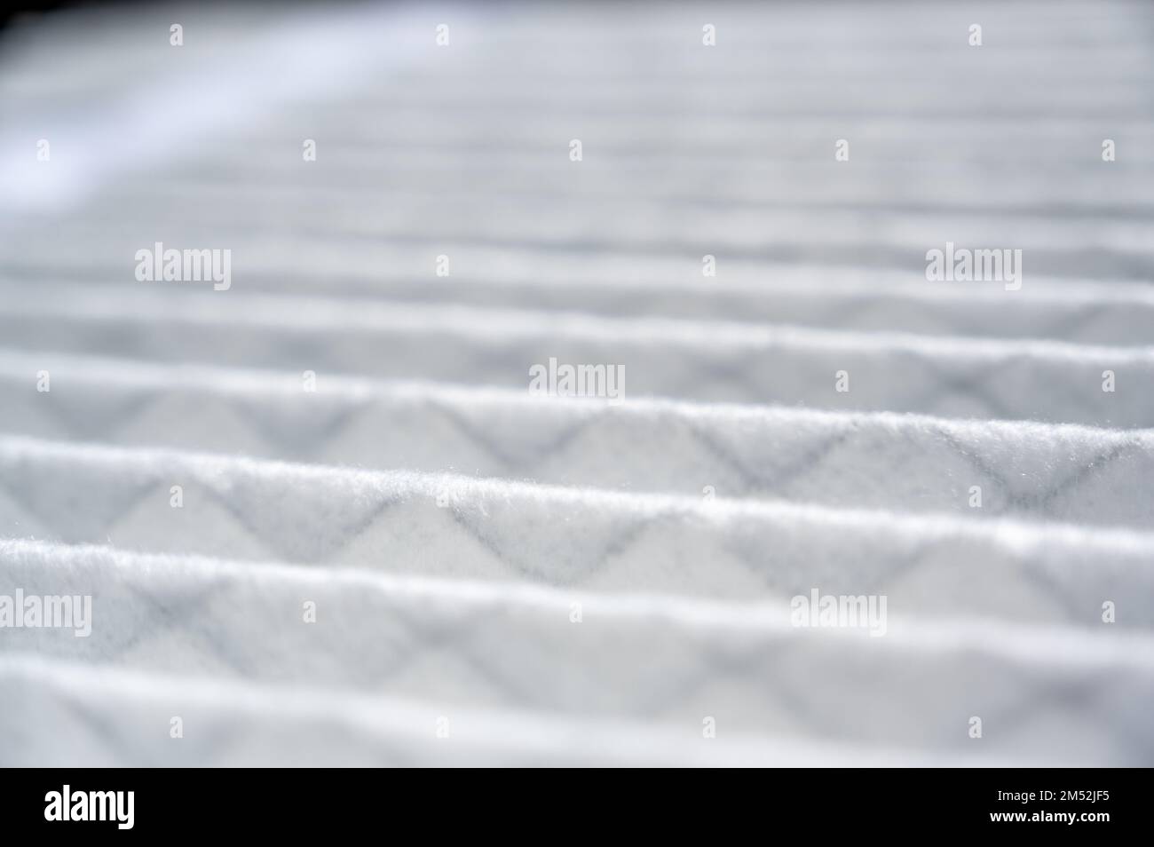 Selective focus on section of a new white and clean residential air filter Stock Photo