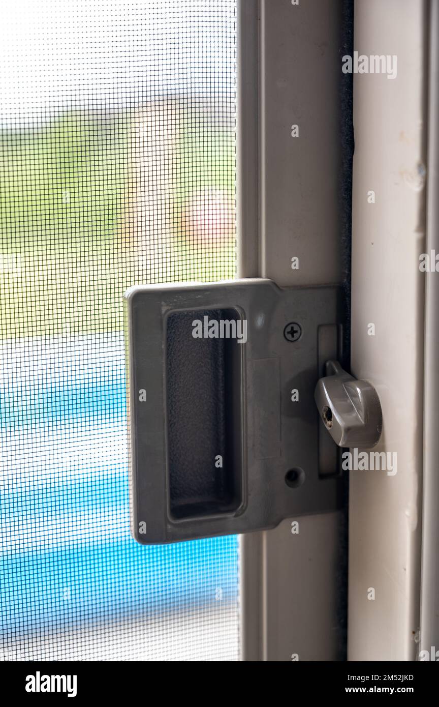 Interior sliding screen door hardware and flip latch Stock Photo Alamy