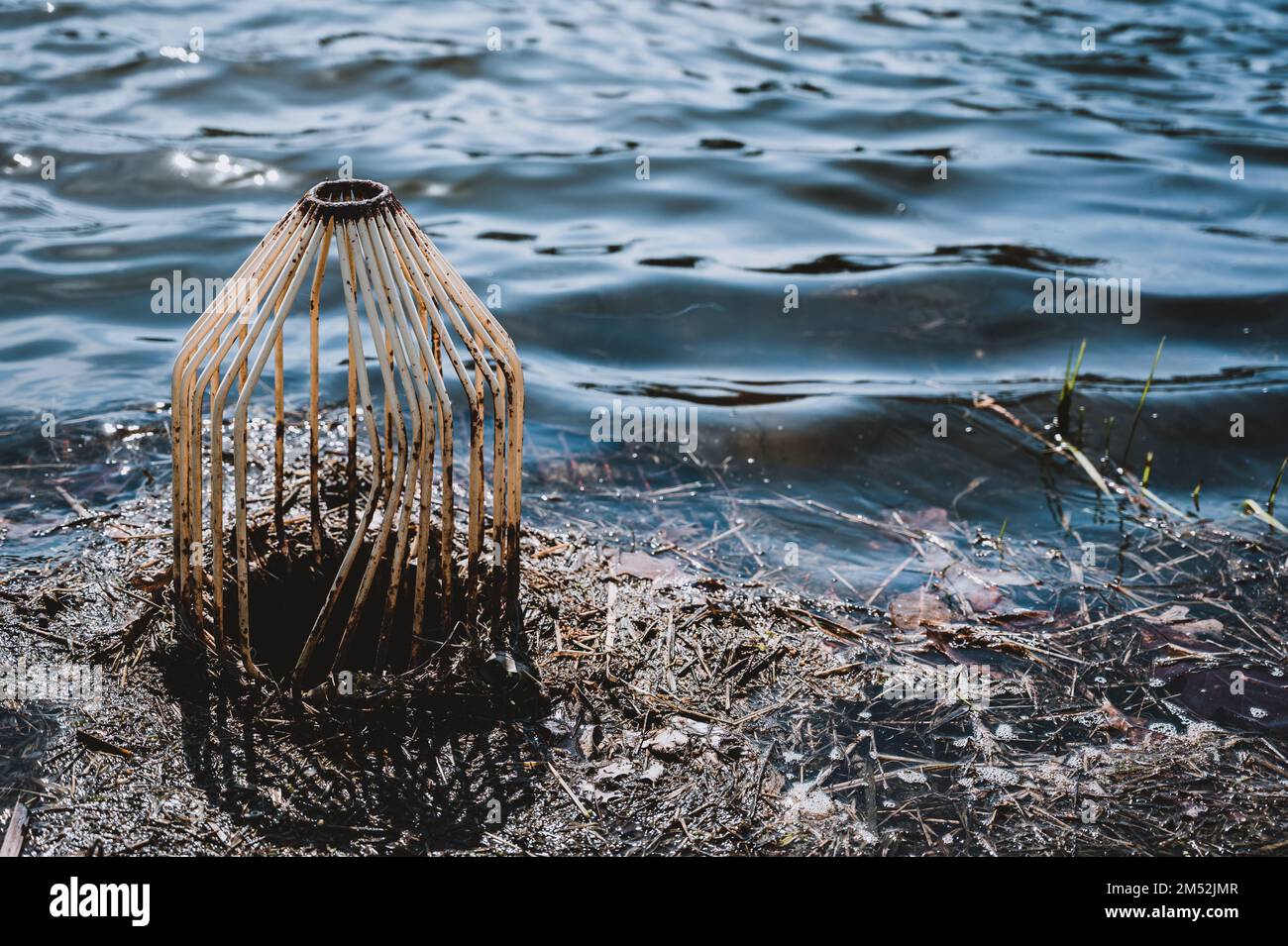 caged pond overflow spillway cover with buildup Stock Photo Alamy