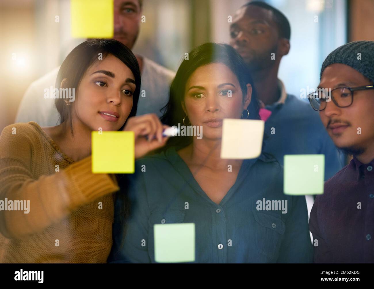 Planning makes our job easier. a team of entrepreneurs collaborating in a modern office. Stock Photo