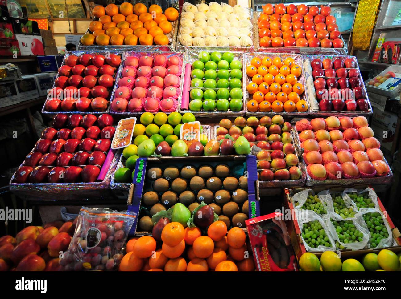 A colorful fruit shop at the New Market in Kolkata, West Bengal, India