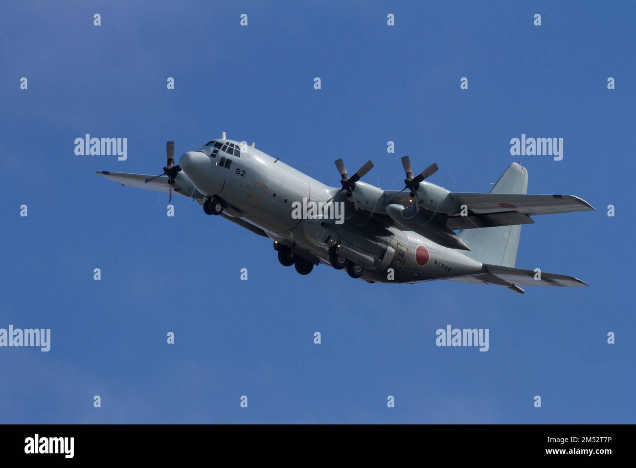A Lockheed C130 Hercules transport aircraft with the Japanese Maritime Self Defence Force (JSMSDF) Fleet air Wing 4 flies near NAF Atsugi. Japan Stock Photo