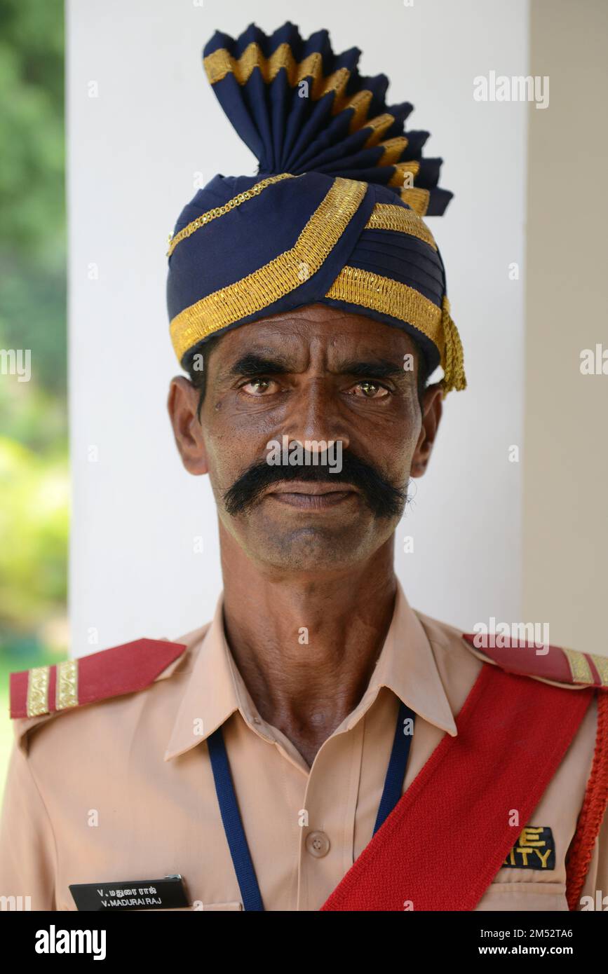 Portrait of a Tamil man wearing a uniform and a colorful turban. Madurai, Tamil Nadu, India. Stock Photo